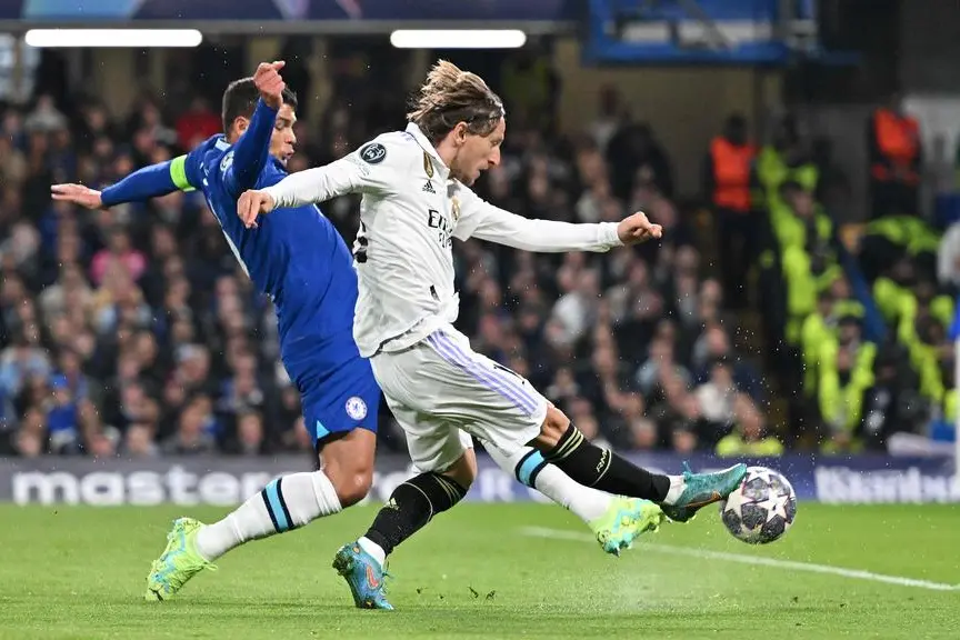 Real Madrid\\'s Croatian midfielder Luka Modric shoots but fails to score during the Champions League quarter-final second-leg football match between Chelsea and Real Madrid at Stamford Bridge in London on April 18, 2023. (Photo by Glyn KIRK / AFP) , Agence France-Presse (AFP)/AFP