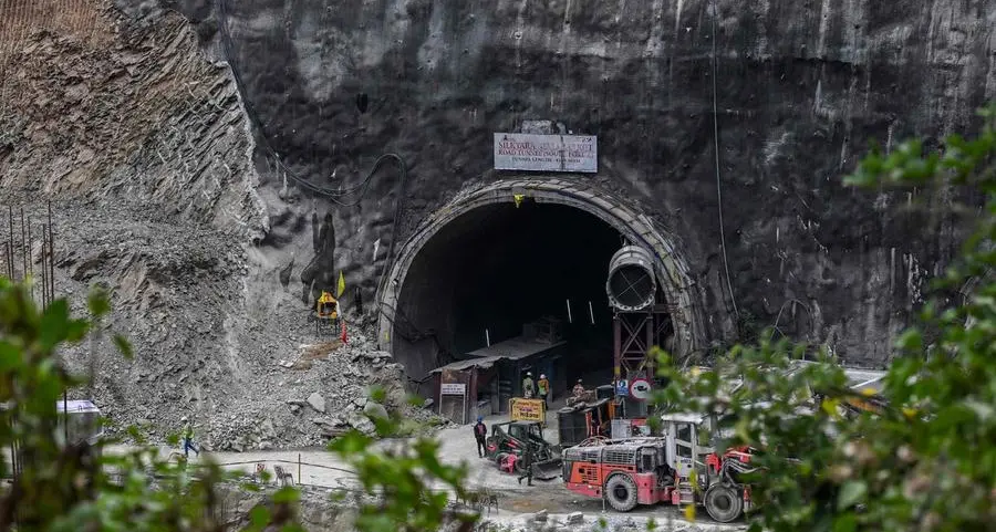 Tearful families pray for Indian workers trapped in tunnel