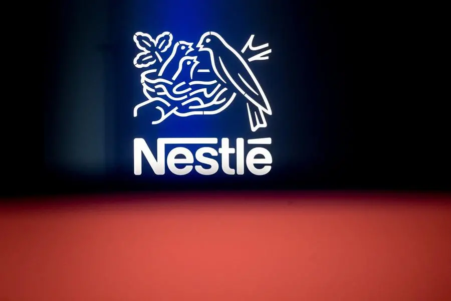 Nestle cuts sales forecast as price rises slow