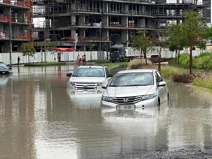 Cars drive through a flooded street during a rain storm in Dubai, United Arab Emirates, April 16, 2024. REUTERS/Abdel Hadi Ramahi