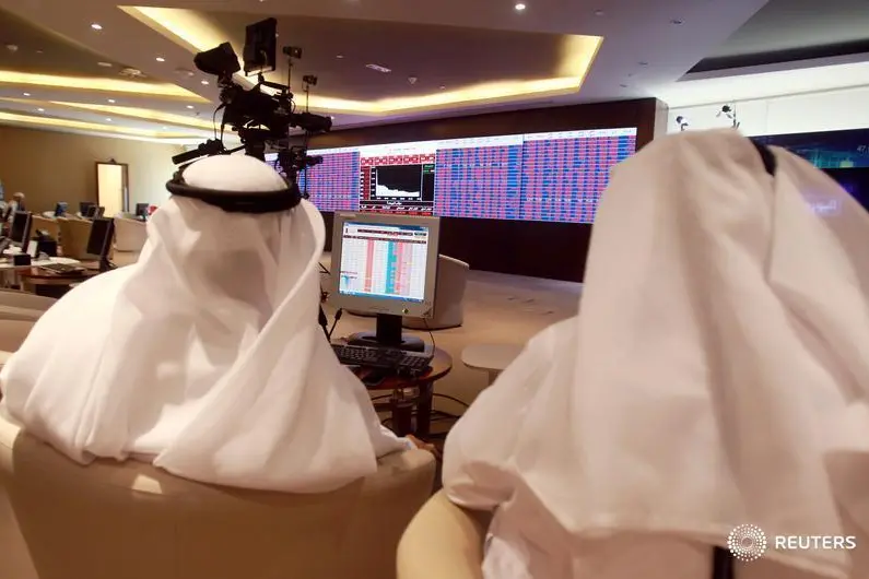 Traders monitor screens displaying stock information at Qatar Stock Exchange in Doha, Qatar June 5, 2017. Reuters Image for illustrative purpose.