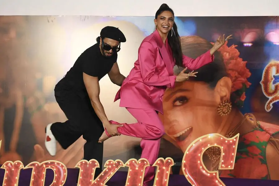 Bollywood actors Ranveer Singh and Deepika Padukone pose for pictures during the song launch of their upcoming Indian Hindi-language period comedy film \\uFFFDCirkus\\uFFFD in Mumbai on December 8, 2022. (Photo by SUJIT JAISWAL / AFP) , Agence France-Presse (AFP)