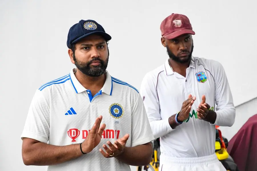 Rohit Sharma (L), of India, and Kraigg Brathwaite (R), of West Indies, applaud at the end of the fifth and final day of the second Test cricket match between India and West Indies at Queen\\'s Park Oval in Port of Spain, Trinidad and Tobago, on July 24, 2023. (Photo by Randy Brooks / AFP) , Agence France-Presse (AFP)/AFP