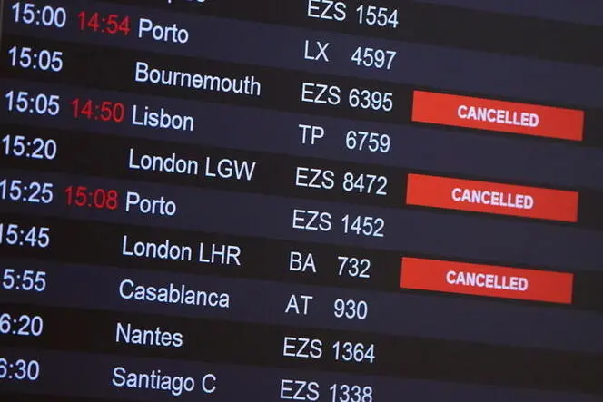 Flights from Britain are announced cancelled at Cointrin airport, the day the Swiss government imposed a 10 days quarantine for travellers who have entered from Britain, during the outbreak of the coronavirus disease (COVID-19) in Geneva, Switzerland, December 21, 2020. REUTERS/Denis Balibouse , Reuters Images/REUTERS