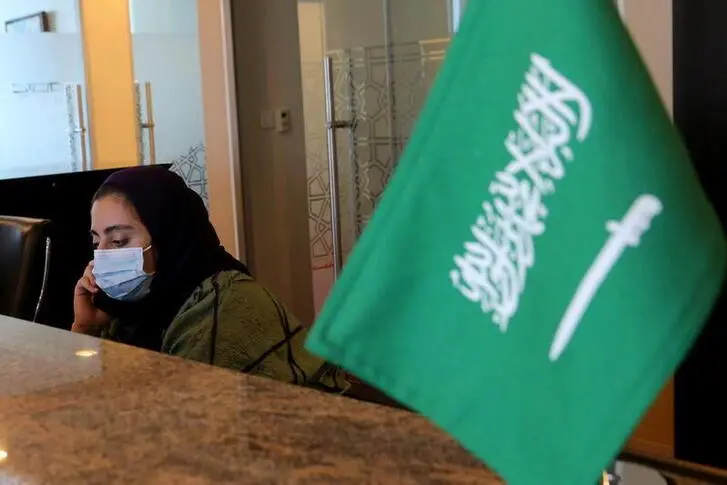 An employee sits at the reception desk of her company\\'s headquarters in Riyadh, Saudi Arabia February 16, 2021. Ahmed Yosri, Reuters. Image used for illustrative purpose. , Reuters Images