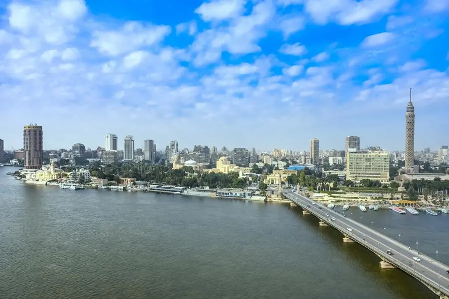 Cairo city skyline with Nile river waterfront, \"6 of October bridge\" and Cairo Tower on Zamalek district of \"Gezira island\" (with Giza pyramids visible in the background as a bonus) in Cairo, Egypt. Getty Images Image for illustrative purpose.