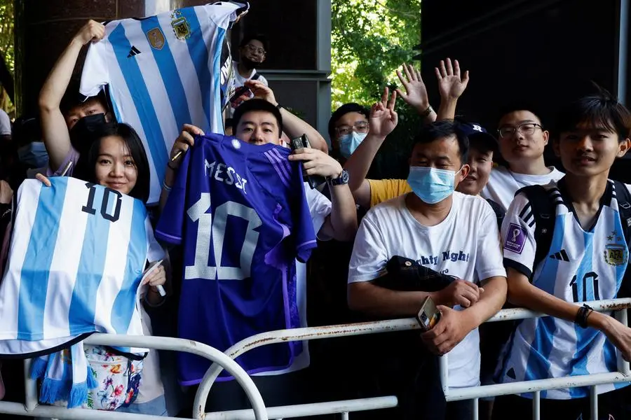 Chinese fans of Argentina\\u2019s Lionel Messi wait for his arrival at a hotel ahead of International Friendly match between Argentina\\'s national football team and Australia national football team in Beijing, China June 10, 2023. REUTERS/Thomas Peter , Reuters