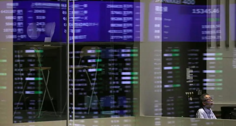 Stocks slip, dollar droops as trade, geopolitical tensions weigh