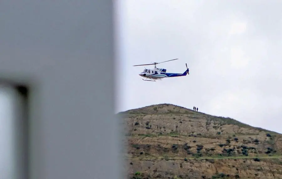 In this photo provided by Islamic Republic News Agency IRNA on May 19, 2024, shows the helicopter carrying Iran's President Ebrahim Raisi taking off at the Iranian border with Azerbaijan after the inauguration of the dam of Qiz Qalasi, in Aras. A helicopter in the convoy of the Iranian president was involved in \\\"an accident\\\" in East Azerbaijan province on May 19, state televsion reported, without specifying if the president was on board. (Photo by Ali Hamed HAGHDOUST / IRNA / AFP)