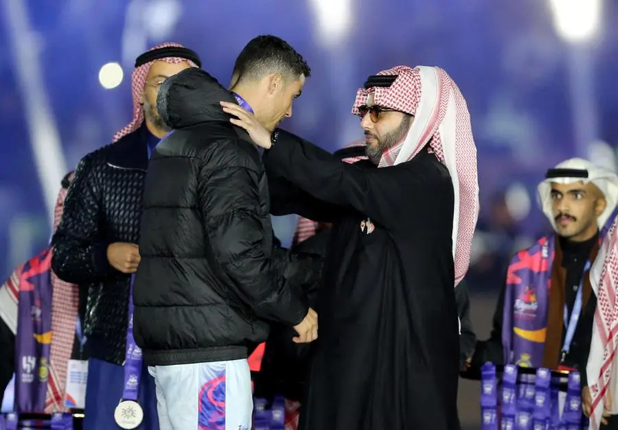 Soccer Football - Friendly - Saudi Pro League XI v Paris St Germain - King Fahd International Stadium, Riyadh, Saudia Arabia - January 19, 2023 Saudi Pro League XI's Cristiano Ronaldo is presented with a medal by Chairman of the General Entertainment Authority Turki Al-AlShikh REUTERS/Ahmed Yosri