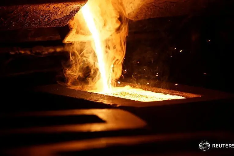 Liquid gold is poured to form gold dore bars at Newmont Mining\\'s Carlin gold mine operation near Elko, Nevada May 21, 2014. The dore bars contain approximately 90 percent gold, 8 percent silver and 2 percent trace material. Image used for illustrative purposes. , Rick Wilking