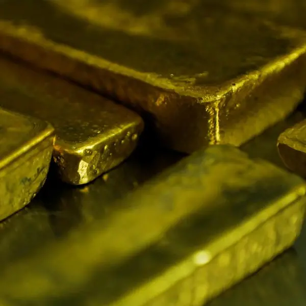 Gold rises as weaker dollar, trade tensions lift safe-haven demand