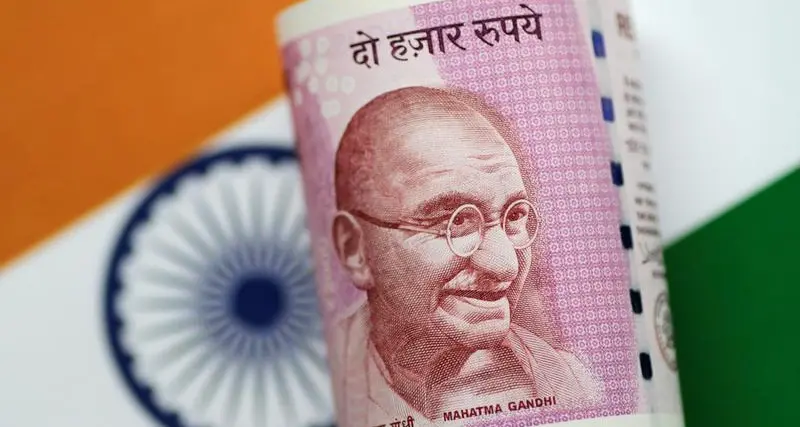 Indian rupee drops to record low as risk aversion boosts dollar