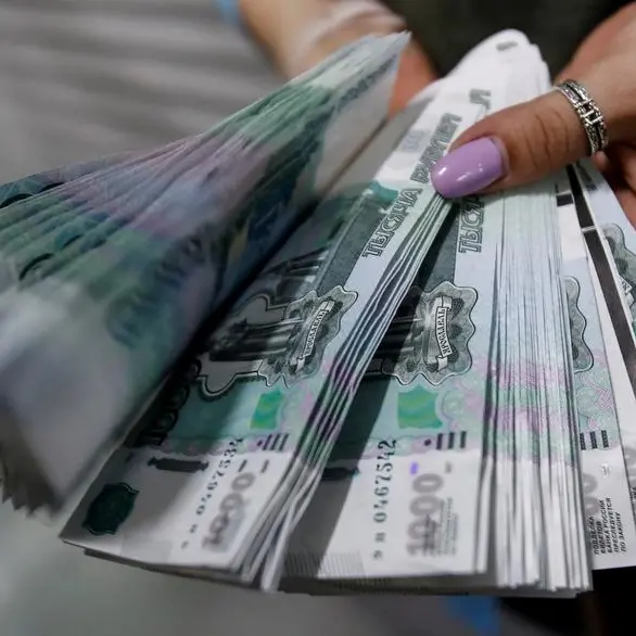 Russian rouble hovers near 93 v dollar after Western sanctions