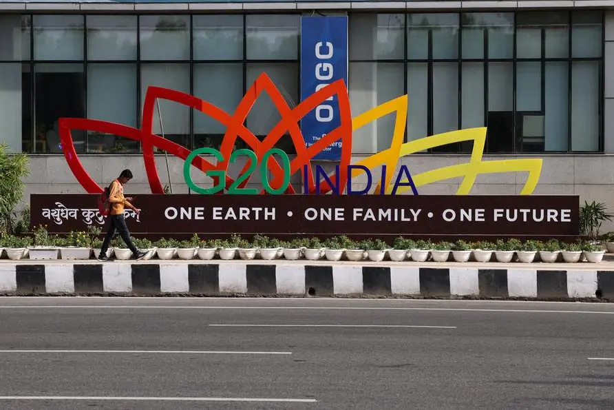 A man walks past a model of the G20 logo outside a metro station ahead of the G20 Summit in New Delhi, India, September 4, 2023. REUTERS/Anushree Fadnavis , Reuters