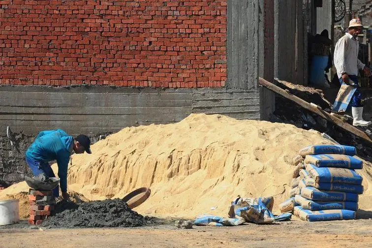 Construction workers are seen at a site on the outskirts of Cairo, Egypt, October 21, 2019. , Shokry Hussien 
