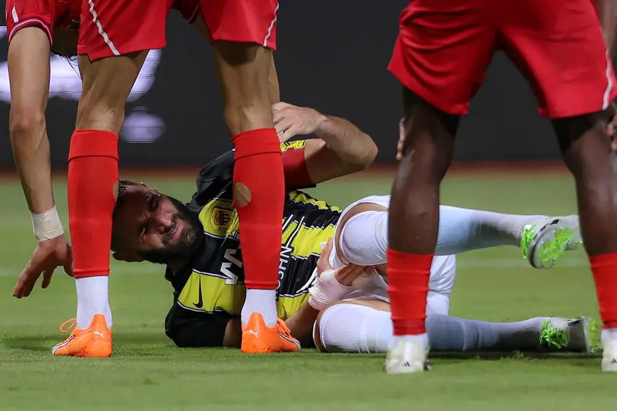 Ittihad\\'s French forward #09 Karim Benzema lies on the pitch during the Saudi Pro League football match between Al-Ittihaq and Al-Wehda at King Abdul Aziz Stadium in Mecca, on August 28, 2023. (Photo by Abdel Ghani BASHIR / AFP) , Agence France-Presse (AFP)/AFP