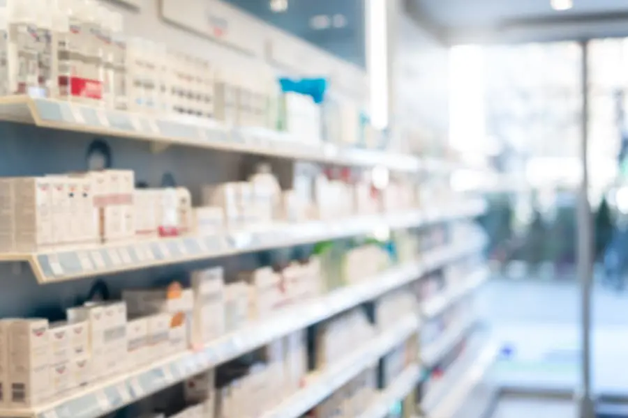 Photo of blurred Pharmacy. Medical product shelves and entry doors. Getty Images Image used for illustrative purpose. , Getty Images