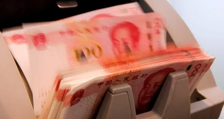 China's yuan climbs to 15-month high, overcoming weak PBOC fixing