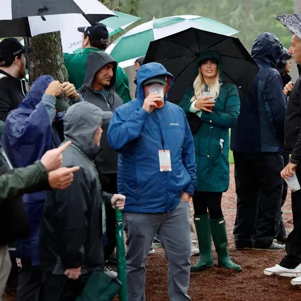 Weather-hit Masters resumes at rainy, chilly Augusta