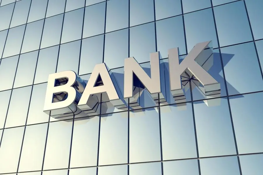 Glass front of a bank building with the word \"BANK\" on the Building , Getty Images/Getty Images