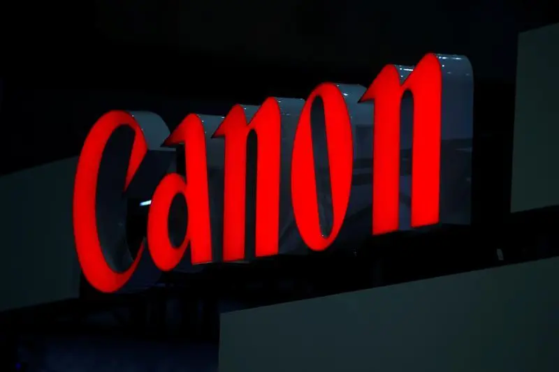 A logo of Canon Inc is pictured at the 3D and Virtual Reality Expo in Tokyo June 20, 2012. REUTERS/Yuriko Nakao/File Photo GLOBAL BUSINESS WEEK AHEAD PACKAGE - SEARCH \\'BUSINESS WEEK AHEAD 24 OCT\\' FOR ALL IMAGES - S1AEUITDRMAB , Reuters Images