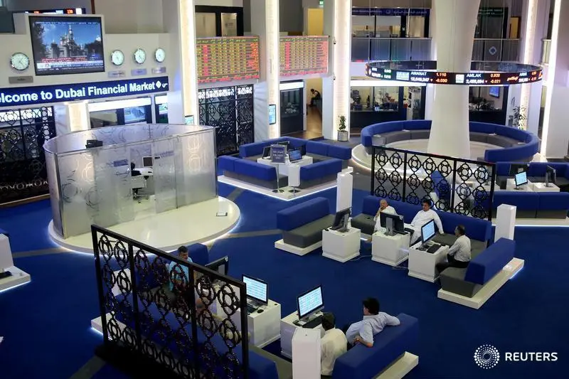 Traders monitor stock information at Dubai Financial Market, in Dubai, United Arab Emirates, June 5, 2017. , Reuters Images/Stringer