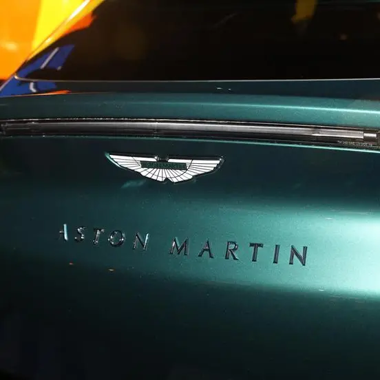 Luxury carmaker Aston Martin halves annual losses