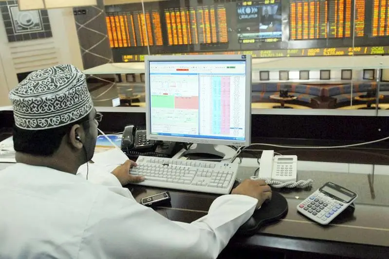 Image for illustrative purpose only. An investor works on his computer above the trading floor of the Muscat Securities Market (MSM) in the Commercial business District of Ruwi in Muscat. STR New, Reuters , Reuters Images