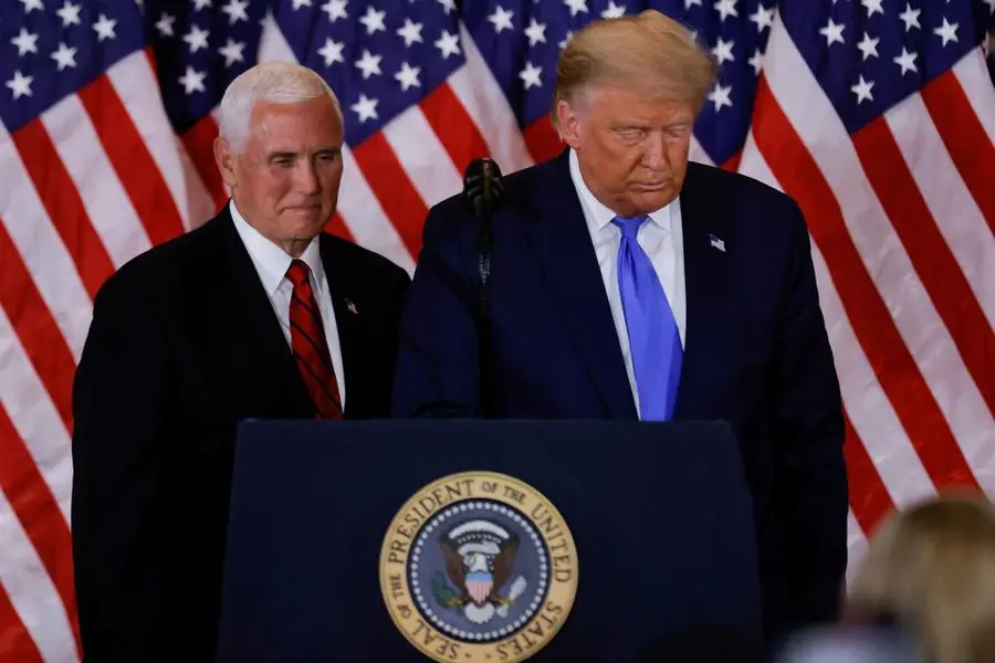 FILE PHOTO: U.S. President Donald Trump and Vice President Mike Pence stand while making remarks about early results from the 2020 U.S. presidential election in the East Room of the White House in Washington, U.S., November 4, 2020. REUTERS/Carlos Barria/File Photo , Reuters