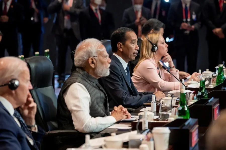 Indonesian President Joko Widodo attends the first session of the G20 summit, next to Italy\\'s Prime Minister Giorgia Meloni, India\\'s Prime Minister Narendra Modi and U.S. President Joe Biden, in Bali, Indonesia, November 15, 2022. Ryan Carter/UAE Presidential Court/Handout via REUTERS