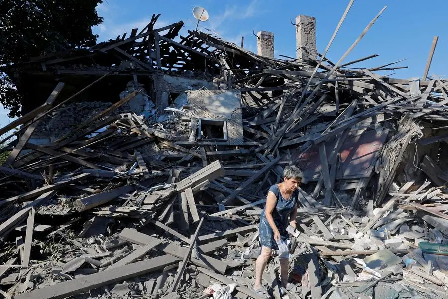 A woman searches for her belongings in the ruins of a house destroyed by recent shelling in the course of Russia-Ukraine conflict in Donetsk, Russian-controlled Ukraine, August 9, 2023. REUTERS/Alexander Ermochenko , Reuters