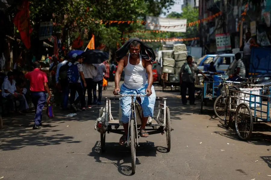 A man rides a rickshaw inside a market on a hot summer day in Kolkata, India, April 30, 2024. REUTERS/Sahiba Chawdhary , Reuters