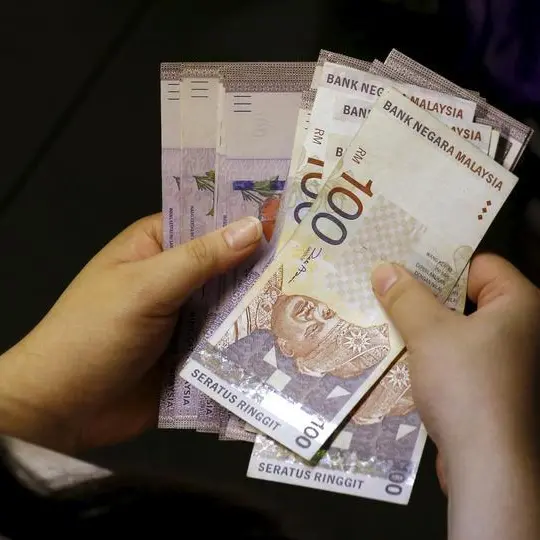 Malaysia PM says ringgit fall concerning but must look at comprehensive view