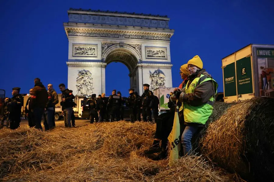 French farmers protest near Paris's Arc de Triomphe