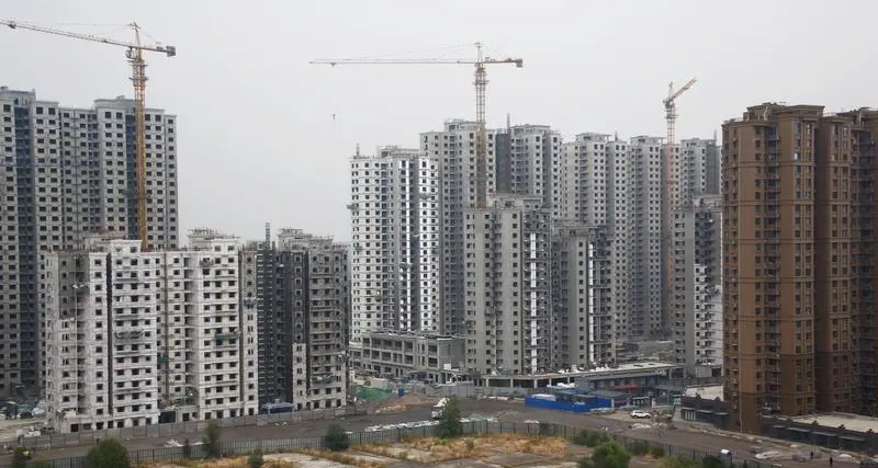 China to let local governments buy homes, cut mortgage rates to revive property sector