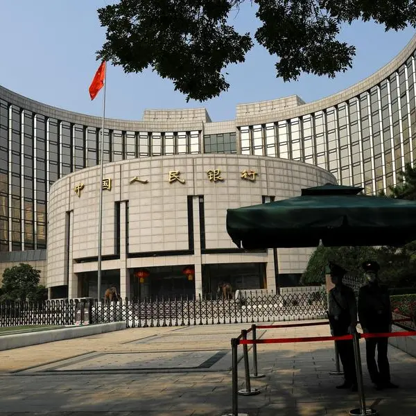China's central bank head pledges to support growth, urges reforms