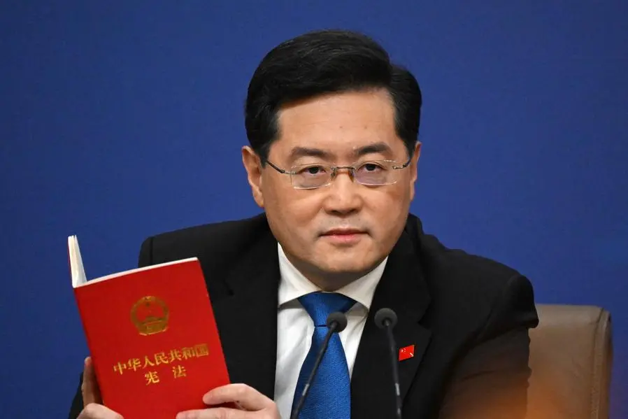 (FILES) China\\'s Foreign Minister Qin Gang holds a copy of China\\'s constitution during a press conference at the Media Center of the National People\\'s Congress (NPC) in Beijing on March 7, 2023. China\\'s Foreign Minister Qin Gang has not been seen in public for almost a month since June 25, 2023, sparking a flurry of questions over his whereabouts. (Photo by NOEL CELIS / AFP) , Agence France-Presse (AFP)/AFP
