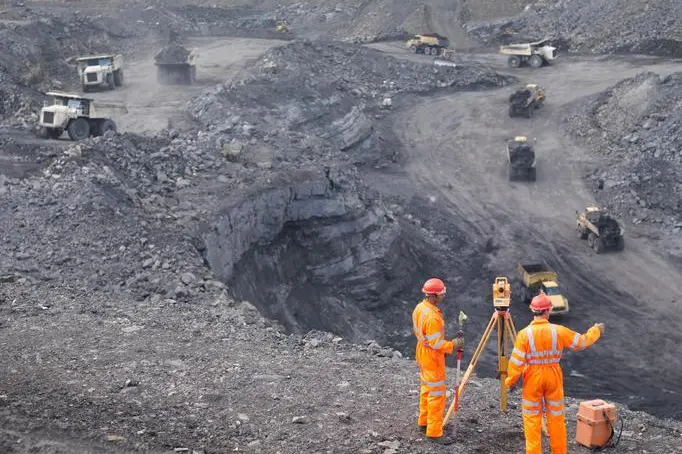 Coal Miners Surveying Mine From Above Image used for illustrative purpose. Getty Images , Getty Images/Monty Rakusen