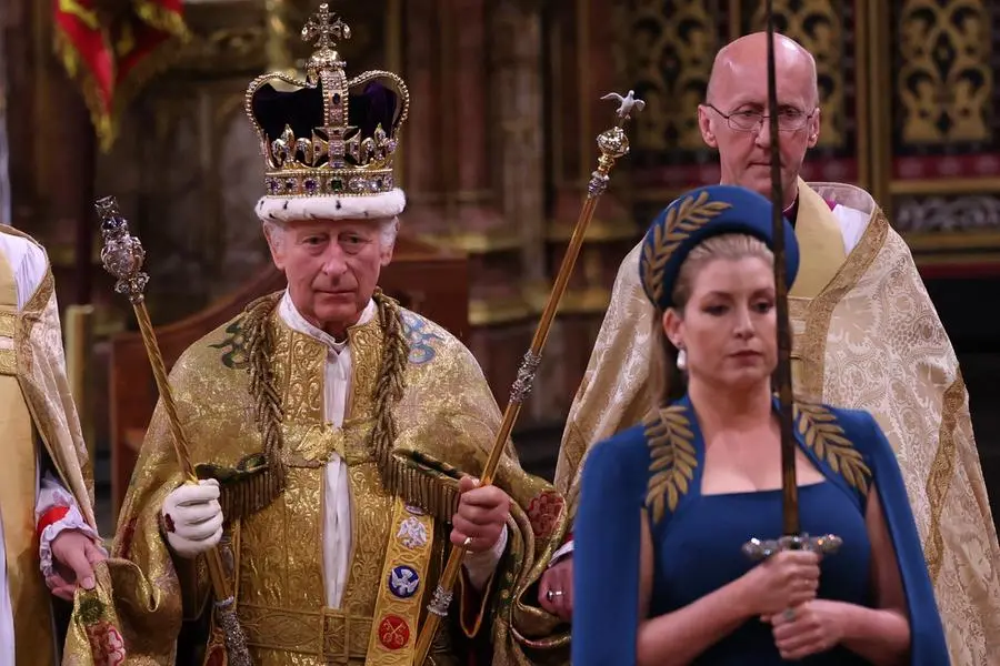 TOPSHOT - Britain's King Charles III walks wearing St Edward's Crown during the Coronation Ceremony inside Westminster Abbey in central London on May 6, 2023. - The set-piece coronation is the first in Britain in 70 years, and only the second in history to be televised. Charles will be the 40th reigning monarch to be crowned at the central London church since King William I in 1066. Outside the UK, he is also king of 14 other Commonwealth countries, including Australia, Canada and New Zealand. Camilla, his second wife, will be crowned queen alongside him and be known as Queen Camilla after the ceremony. (Photo by Richard POHLE / POOL / AFP)