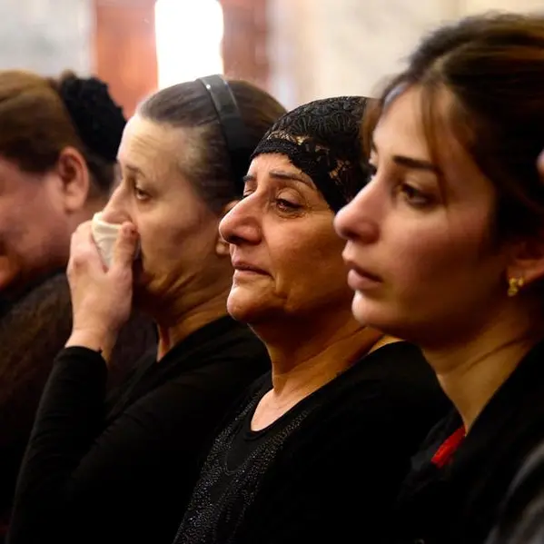 Grief, anger at Iraq mass for victims of wedding fire