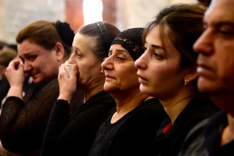 Grief, anger at Iraq mass for victims of wedding fire