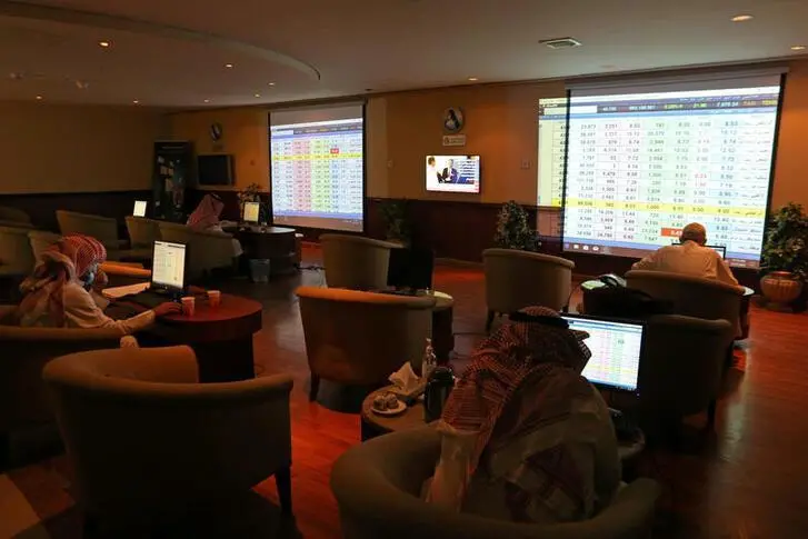 Saudi traders monitor stock information at the Saudi stock market in Riyadh, Saudi Arabia August 25, 2020. , Ahmed Yosri