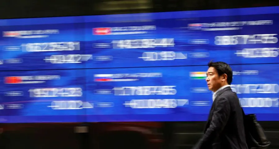 Asian shares slide as traders fret on Fed rates