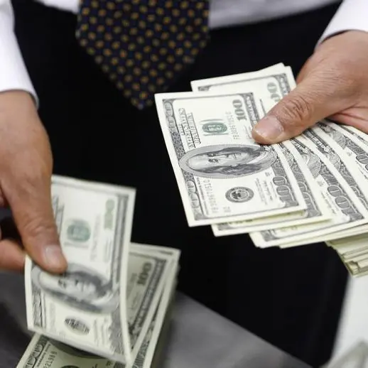 Dollar retreats on jump in US jobless claims; eyes on Fed