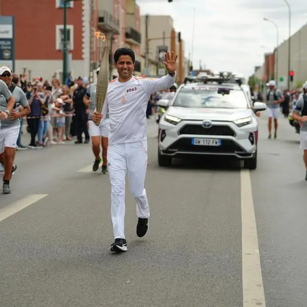 PSG President Nasser Al-Khelaïfi takes part in Olympic torch relay in Paris ahead of opening ceremony