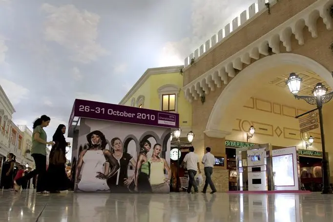 Image used for illustrative purpose. Shoppers walk inside Villagio Mall, a popular shopping area in Doha October 3, 2010. REUTERS/Fadi Al-Assaad Image used for illustrative purpose. , Reuters Images