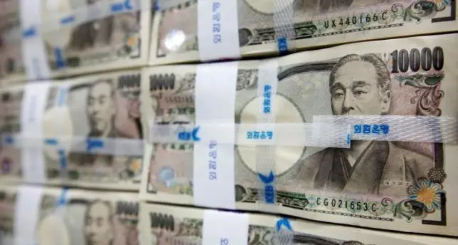 Japan's yen falls to lowest since 1990, dollar/yen up 0.6%