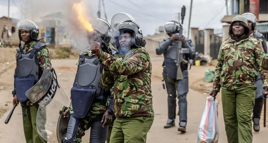 Kenya police fire tear gas as protesters defy ban