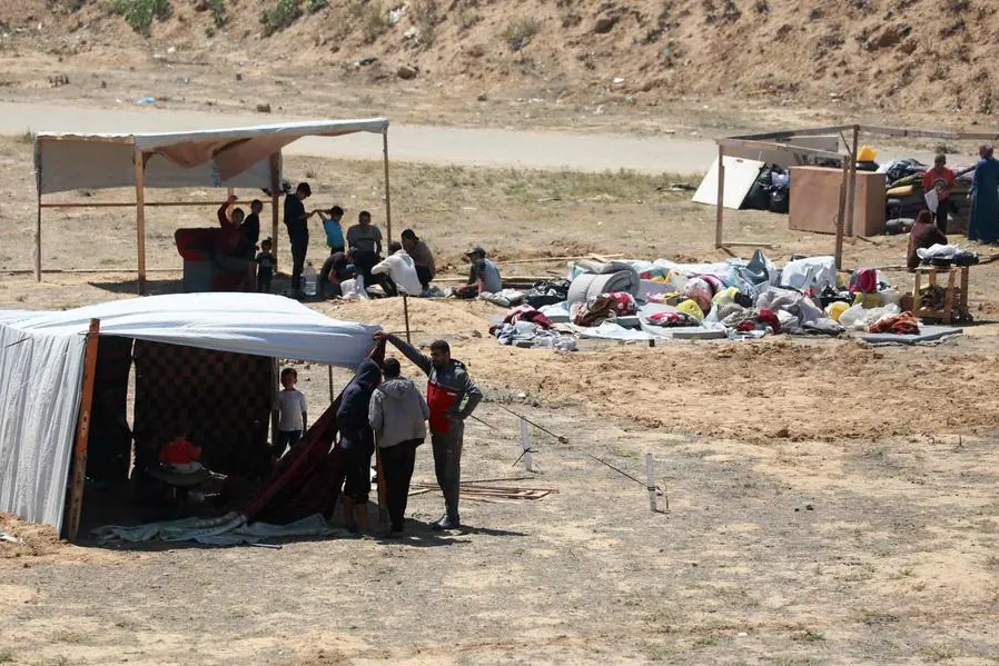 Displaced Palestinians set up tents on a beach, near Deir el-Balah, in the central Gaza Strip, on May 7, 2024, amid the ongoing conflict between Israel and the Palestinian militant group Hamas. (Photo by AFP) , Agence France-Presse (AFP)/AFP